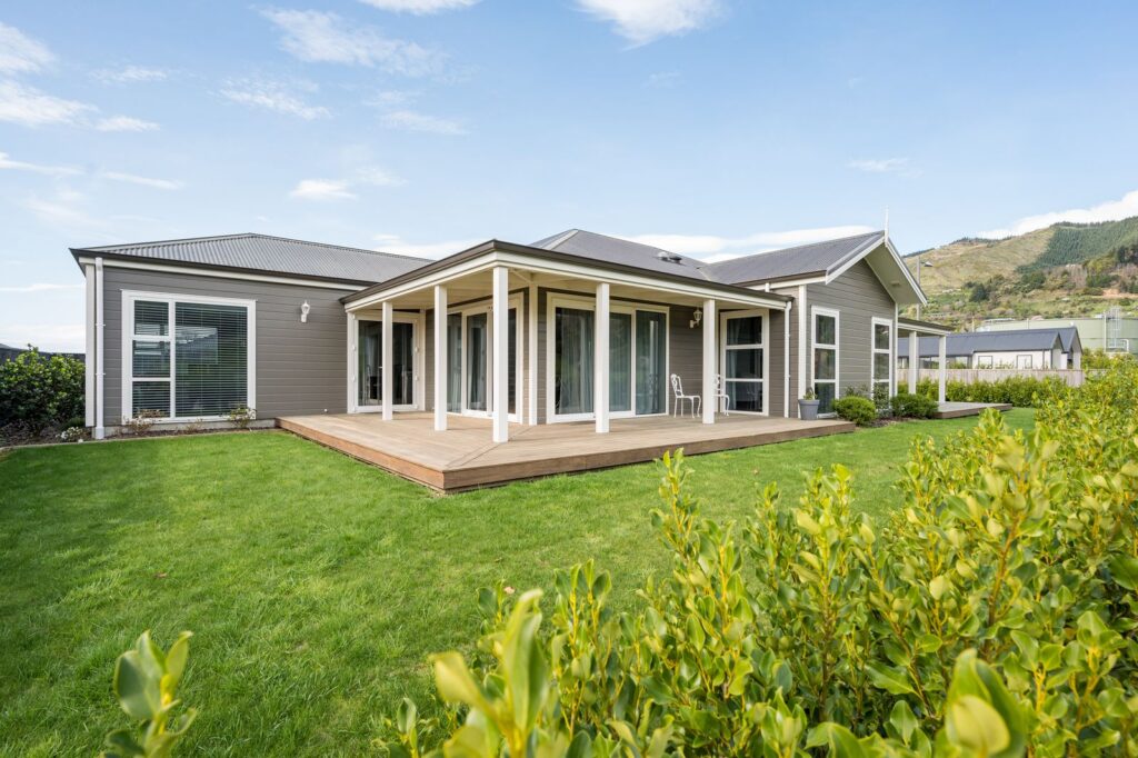 Cupola Crescent home with a wide timber deck and veranda posts