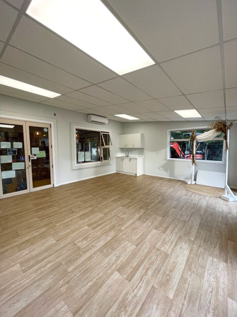 Renovated day care room with new flooring and lighting
