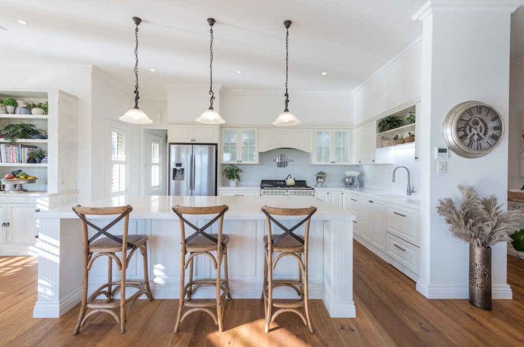 White French colonial style kitchen with timber bar stools at Marionberry Lane