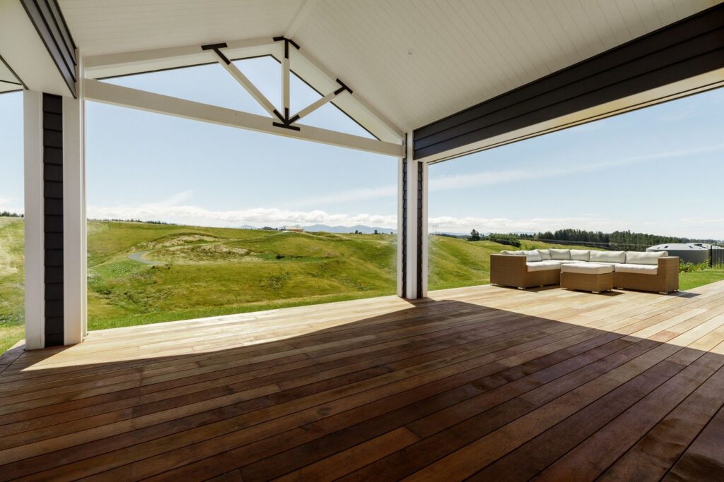 Covered hardwood deck at Redvale Estate looking out over the hills