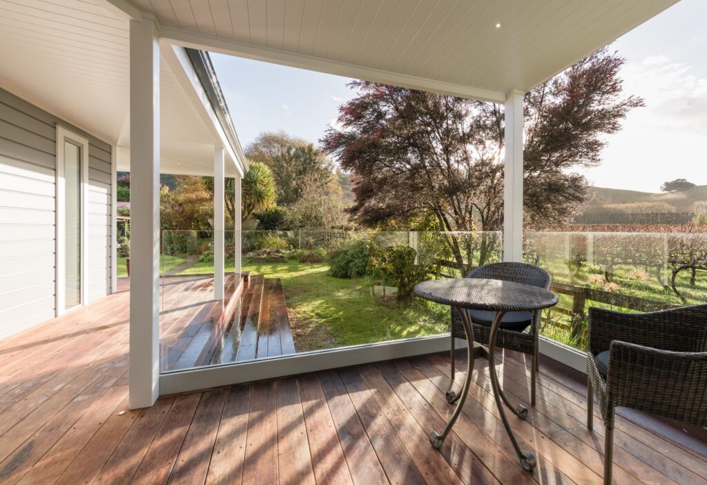 Covered deck off the new living room in the Takaka Hill renovation