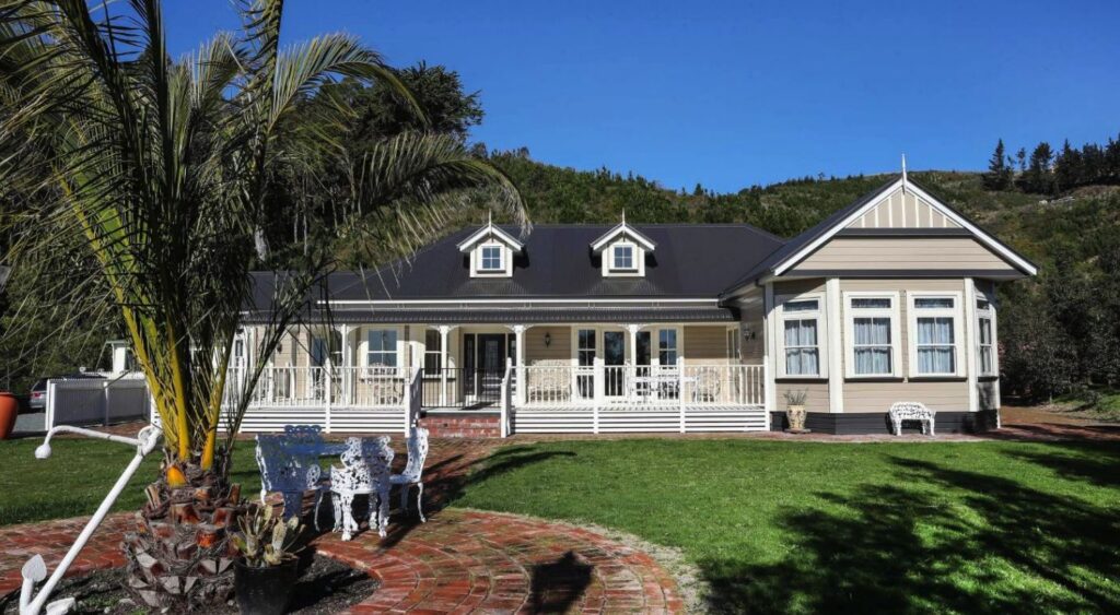 Colonial style home at Wakapuaka with dormer windows and white veranda